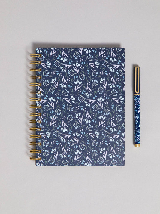 Navy floral spiral journal and pen set on a white background